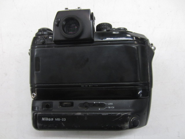 Camera, 35mm, Nikon F4 Camera Body. Serial Number 2166796, With MB23 Battery Power Adapter Attached, Non-Operational, Black, Nikon, 1980s+, Plastic, 6"H, 6"W, 3"L