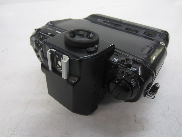 Camera, 35mm, Nikon F4 Camera Body. Serial Number 2166796, With MB23 Battery Power Adapter Attached, Non-Operational, Black, Nikon, 1980s+, Plastic, 6"H, 6"W, 3"L