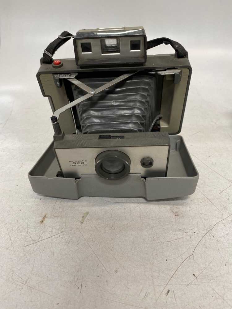 Poloroid Automatic 320 Land Camera.  Has incorrect cover with 210 model number.  Introduced 1969, Gray, Polaroid, 1970s+, Plastic