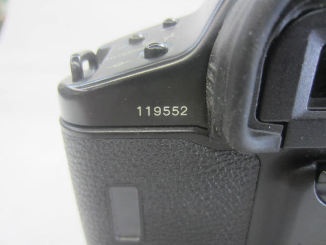 Camera, 35mm, Canon Model EOS-1 Camera Body, Serial Number 119552, With Cap And BP Attached With Wrist Strap, Non-Operational, Black, Canon, 1990s+, Metal