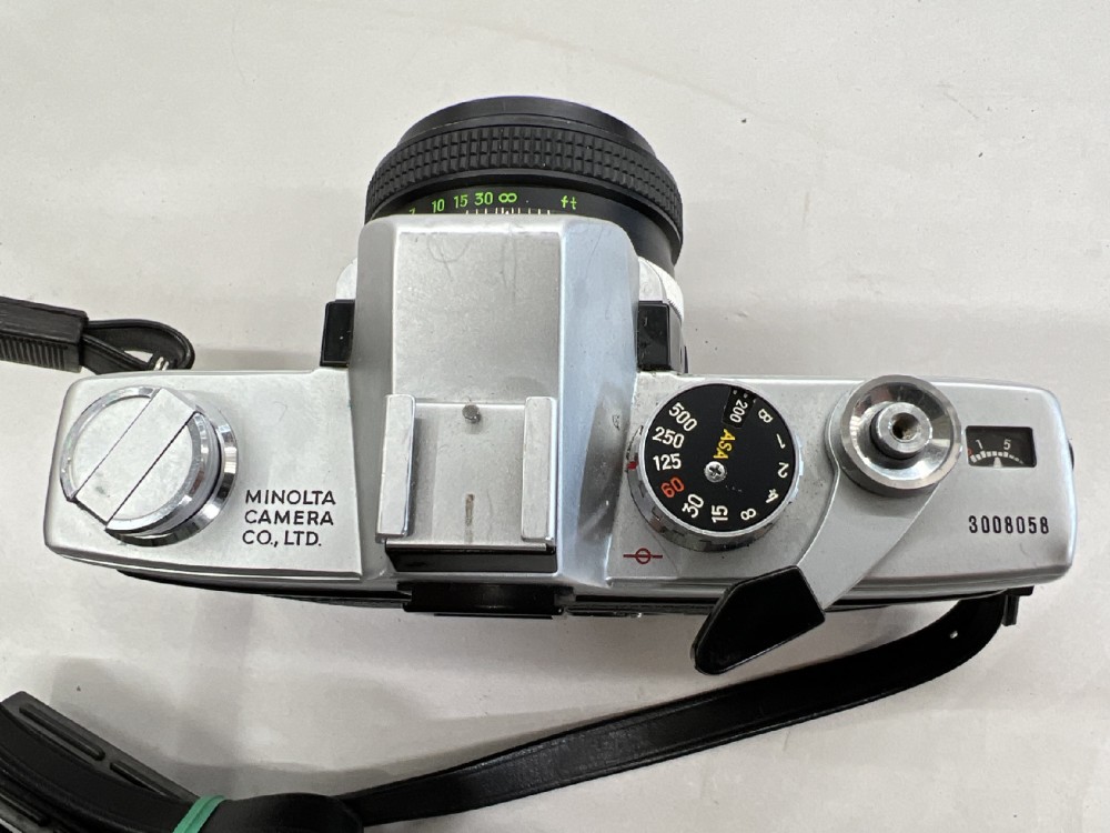 Camera, 35mm, Minolta Model SRT100, Serial Number 3008058, With Shoulder Strap, Lens Cap, And Non-Removable Lens (Minolta Rokkor-PF, 55mm), Silver, 1970s+, Metal