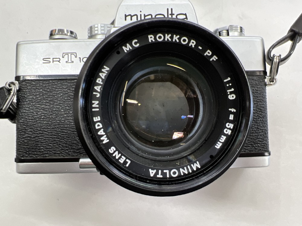 Camera, 35mm, Minolta Model SRT100, Serial Number 3008058, With Shoulder Strap, Lens Cap, And Non-Removable Lens (Minolta Rokkor-PF, 55mm), Silver, 1970s+, Metal