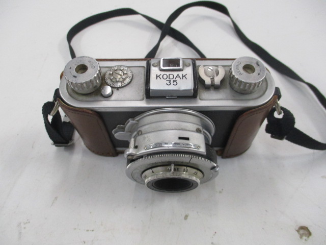 Camera, Kodak 35, Ser.No.27317, With Partial Leather Case And Black Strap, Circa 1938, Silver, 1930+, Metal, USA