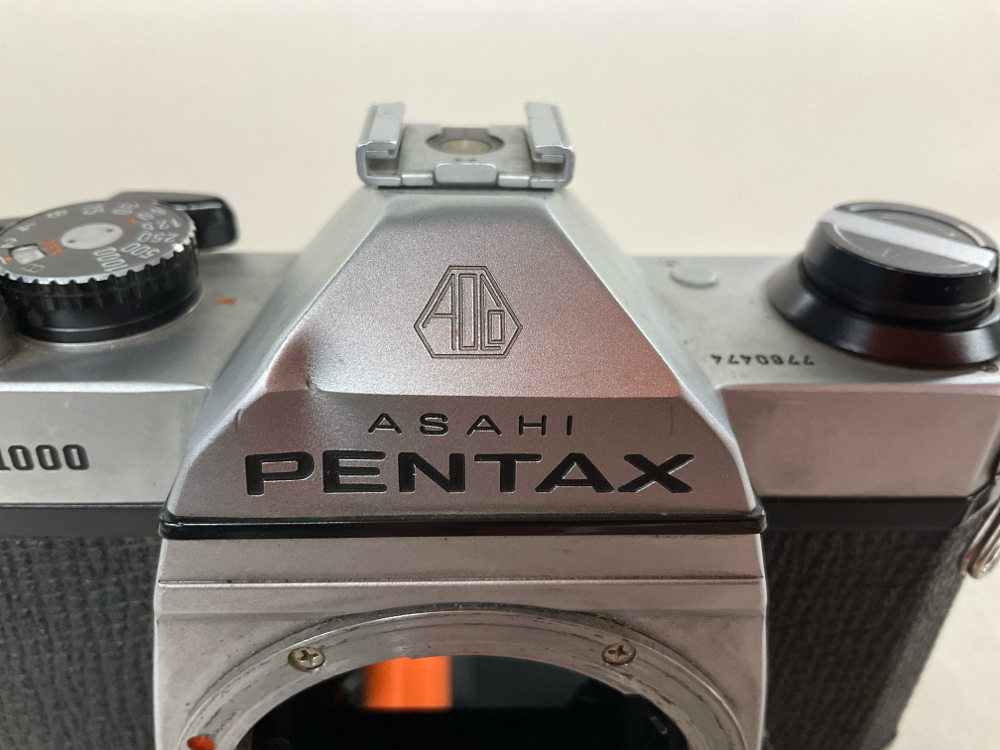Camera, 35mm, Asahi Pentax Model K-1000, Serial Number 7760474.  View Finder dented in front., Black, 1960s+, Metal
