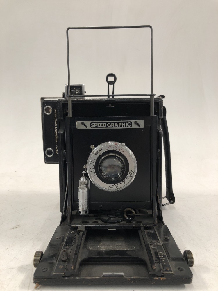 Camera, Graflex Speed Graphic, No Serial Number, With Kodak Number 2 Supermatic 127mm Lens Serial Number EY1354, With Film Magazine And Side Handle, Black, 1940s+