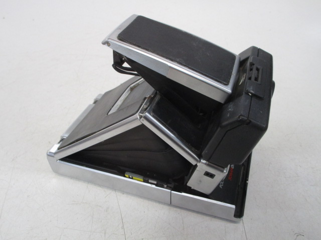 Camera, Polaroid SX 70 Lamd Camera Sonar One Step.  Uses SX70 film.  Introduced: 1978, Silver, Polaroid, 1970s+, Metal