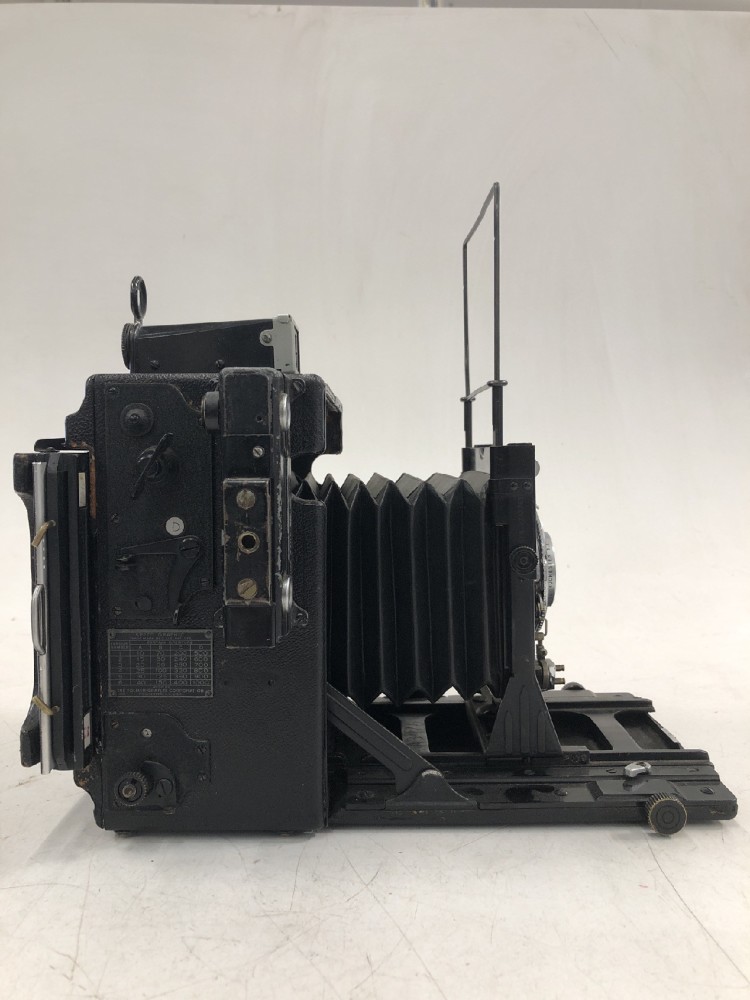 Camera, Graflex Speed Graphic, No Serial Number, With Kodak Supermatic 127mm Lens Serial  Number EC2912, With Film Magazine And Side Handle, Black, 1940s+, Wood, USA