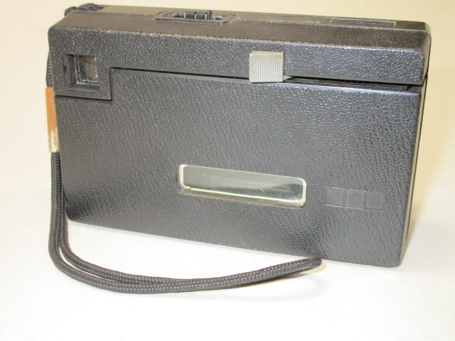Camera, Kodak Instamatic X-15F, Amateur Camera With Wrist Strap, Manufactured From 1976 To 1981, Uses 126 Film, Does Not Need Batteries To Flash, Uses Expendable Flip Flash (Sold Seperately), Brown, Kodak, 1970s+, Plastic
