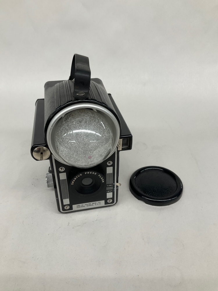 Spartus Press Flash camera.  Uses 120/220 film.  Uses #40 Press Bulbs.  Introduced 1939., Black, Spartus, 1940s+, Plastic, 5.5"L, 4.5"W, 7"H