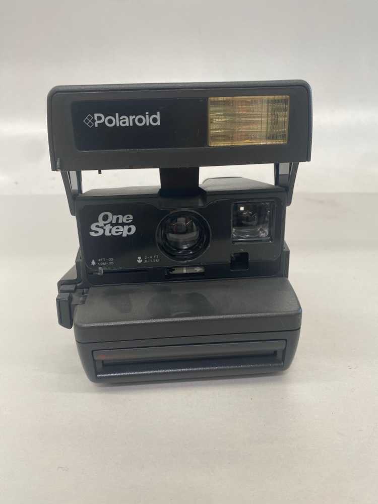 Polaroid Camera. One Step, takes 600 Polaroid Film.  Introduced: 1992, Black, Polaroid, 1990s+, Plastic