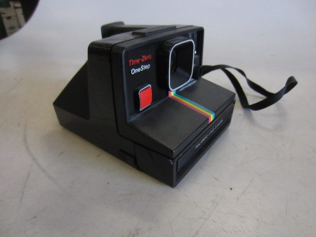 Polaroid Land Camera Time Zero One Step, With Strap. Rainbow Stripe Down Front Center.  Uses SX70 Film.  Introduced: 1981, Black, Blue, Polaroid, 1980s, Plastic
