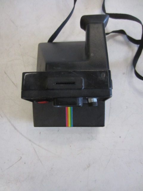 Polaroid Land Camera Time Zero One Step, With Strap. Rainbow Stripe Down Front Center.  Uses SX70 Film.  Introduced: 1981, Black, Blue, Polaroid, 1980s, Plastic